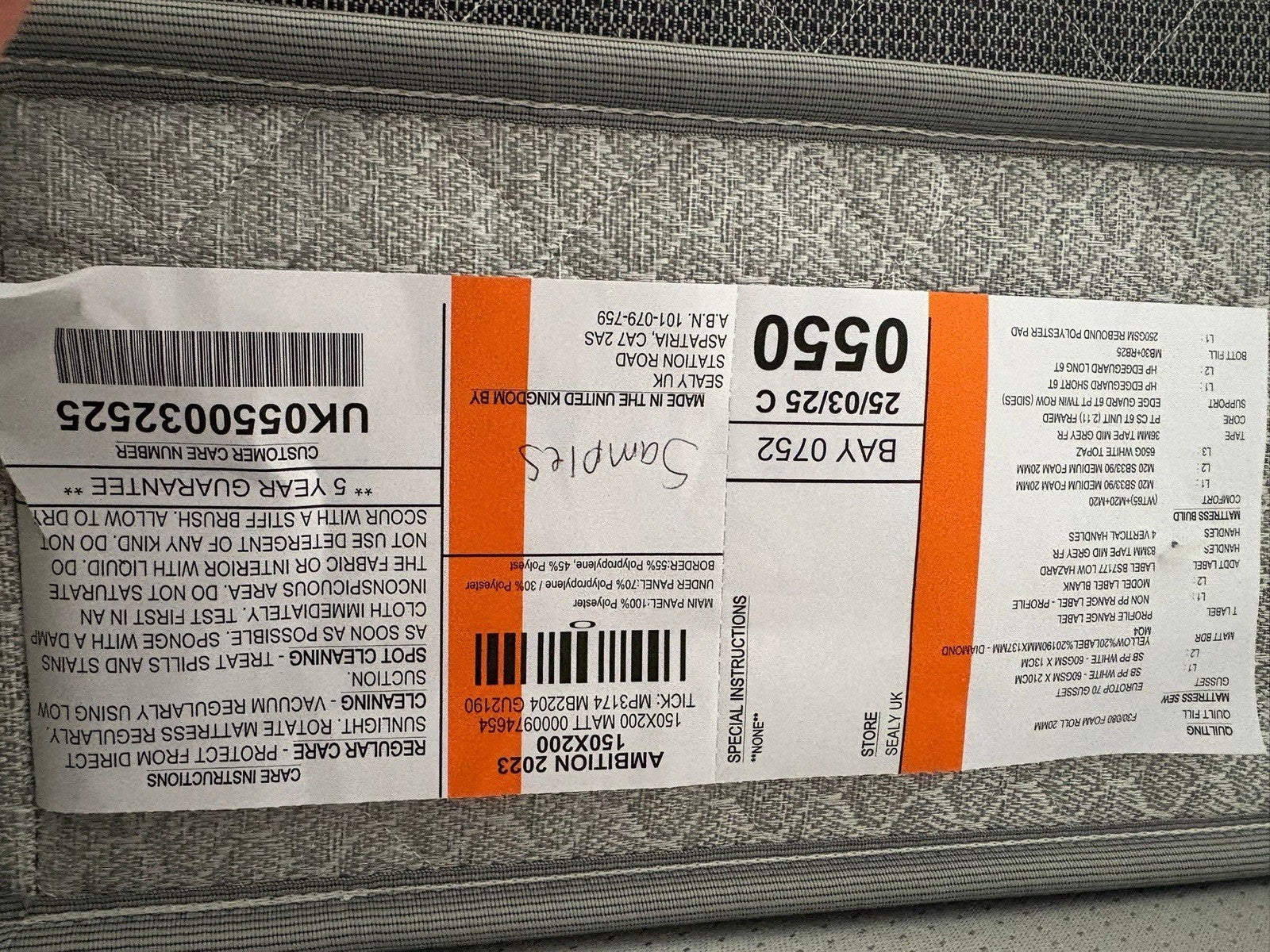 Close-up of a product label with text and barcodes on a gray background